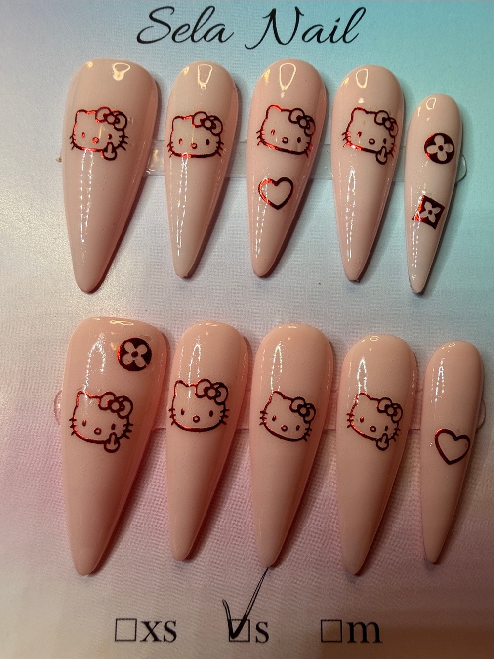 Hello Kitty Pale Pink Stiletto Press-On Nail Set with Red Accents